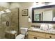 Bathroom with a walk-in shower, granite countertops, and a framed mirror at 4901 N Market St., North Myrtle Beach, SC 29582