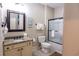 Bathroom with granite countertop vanity, toilet, and glass door shower at 4901 N Market St., North Myrtle Beach, SC 29582