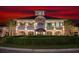 Elegant multi-story building featuring covered balconies, manicured hedges, and a prime steak house on the ground floor at 4901 N Market St., North Myrtle Beach, SC 29582