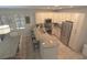 Open kitchen layout with granite countertops, stainless steel appliances, and a breakfast bar at 4901 N Market St., North Myrtle Beach, SC 29582