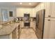 Well-equipped kitchen featuring stainless steel appliances, granite countertops, and neutral cabinetry at 4901 N Market St., North Myrtle Beach, SC 29582