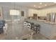 Bright kitchen with a dining table, counter seating, and modern stainless steel appliances at 4901 N Market St., North Myrtle Beach, SC 29582