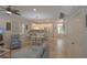 Bright and airy open-concept living space with a sofa, dining area, and an adjacent modern kitchen at 4901 N Market St., North Myrtle Beach, SC 29582