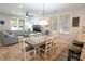 Inviting living area with a large sofa, dining space, and decorative lighting, perfect for relaxation and entertaining at 4901 N Market St., North Myrtle Beach, SC 29582