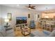 Open-concept living area with modern furnishings, including a plush sectional sofa and stylish dining table, seamlessly connecting to the kitchen at 4901 N Market St., North Myrtle Beach, SC 29582