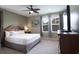 Comfortable bedroom features a ceiling fan, neutral tones, and carpeted floors at 4901 N Market St., North Myrtle Beach, SC 29582