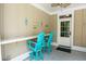 Covered patio with bar top, colorful stools, and beach-themed decor provides an ideal spot for outdoor entertaining at 4901 N Market St., North Myrtle Beach, SC 29582