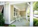 Cozy covered porch with classic rocking chairs, offering a charming and relaxing outdoor space at 4901 N Market St., North Myrtle Beach, SC 29582