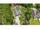 Aerial view of a home with an oversized driveway, well-manicured landscaping and a pool at 499 Trestle Way, Conway, SC 29526