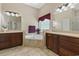 Relaxing bathroom with a soaking tub, double vanities, and tile flooring at 499 Trestle Way, Conway, SC 29526