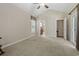 Large bonus room with ensuite bathroom access, window, and neutral carpet at 499 Trestle Way, Conway, SC 29526