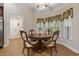 Cozy breakfast nook with a round wood table and bright natural light at 499 Trestle Way, Conway, SC 29526