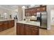 Open kitchen with granite countertops, stainless steel appliances, and wood cabinetry at 499 Trestle Way, Conway, SC 29526
