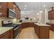 Well-equipped kitchen with stainless steel appliances, granite countertops, and a center island for meal prep at 499 Trestle Way, Conway, SC 29526