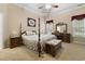 Serene main bedroom with a four-poster bed, soft lighting, and neutral tones at 499 Trestle Way, Conway, SC 29526