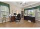 Spacious home office with a large desk, comfortable chair, and natural light at 499 Trestle Way, Conway, SC 29526