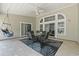 Covered patio with stylish furniture, ceiling fan, and decorative rug at 499 Trestle Way, Conway, SC 29526