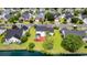 Aerial shot of a backyard with red patio, showcasing community with well-maintained lawns and waterfront views at 5096 Capulet Circle, Myrtle Beach, SC 29588