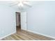 Clean bedroom with wood-look floors and fresh paint; includes open doorway to hall at 5096 Capulet Circle, Myrtle Beach, SC 29588