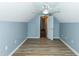 Attic bedroom with wood-look floors, a ceiling fan, and dormer storage at 5096 Capulet Circle, Myrtle Beach, SC 29588