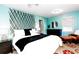 Inviting bedroom with bright aqua walls, modern furnishings, and cozy decor for a peaceful retreat at 514 Blockade Dr., Pawleys Island, SC 29585