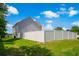 Large, private backyard featuring a white fence and green grass at 547 Pacific Commons Dr., Surfside Beach, SC 29575