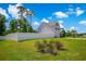 Large, private backyard with a white fence and lush landscaping at 547 Pacific Commons Dr., Surfside Beach, SC 29575