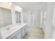 Bright bathroom features dual sinks, modern fixtures, and a glass-enclosed shower for a spa-like experience at 547 Pacific Commons Dr., Surfside Beach, SC 29575