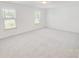 Spacious bedroom with neutral carpet, lots of natural light, and a calming atmosphere at 547 Pacific Commons Dr., Surfside Beach, SC 29575