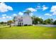 Well-maintained home with a spacious yard, featuring a classic design and lush green surroundings at 547 Pacific Commons Dr., Surfside Beach, SC 29575