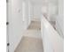 Bright second story hallway featuring neutral carpet, white trim and doors at 547 Pacific Commons Dr., Surfside Beach, SC 29575