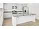 Modern kitchen featuring granite countertops, stainless steel appliances, and stylish gray cabinets at 547 Pacific Commons Dr., Surfside Beach, SC 29575