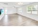 Bright and airy living room with a ceiling fan and a glass door to the backyard at 547 Pacific Commons Dr., Surfside Beach, SC 29575