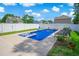 Inviting backyard pool with a spa, surrounded by lounge chairs and a well-maintained patio at 547 Pacific Commons Dr., Surfside Beach, SC 29575