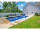 Gorgeous pool with lounge chairs and a beautiful patio in a private backyard at 547 Pacific Commons Dr., Surfside Beach, SC 29575