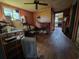 This room offers hardwood floors, a ceiling fan, and adjoins the kitchen with vintage decor at 564 Baker Ave., Murrells Inlet, SC 29576