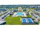 Aerial view of the neighborhood pool, amenity center, and tennis courts at 598 Cascade Loop, Little River, SC 29566
