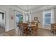 Bright dining room featuring natural light, wood table, and a chandelier at 598 Cascade Loop, Little River, SC 29566