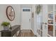 Entryway displaying modern decor with a foyer table and view of the office area at 598 Cascade Loop, Little River, SC 29566