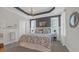 This main bedroom features gray walls and a decorative tray ceiling with a chandelier at 598 Cascade Loop, Little River, SC 29566