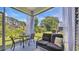 Relaxing screened porch with seating area overlooking the lush backyard at 598 Cascade Loop, Little River, SC 29566