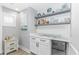 Modern bar area with marble countertop, white cabinets, and mini fridge at 6001- Q10 S Kings Hwy., Myrtle Beach, SC 29575