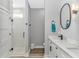 Modern bathroom featuring a glass enclosed shower, stylish vanity with a white countertop and sleek fixtures at 6001- Q10 S Kings Hwy., Myrtle Beach, SC 29575