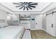 Spacious bedroom with light gray walls, a ceiling fan, and a bar area at 6001- Q10 S Kings Hwy., Myrtle Beach, SC 29575