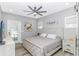 Comfortable bedroom with a ceiling fan, soft lighting, and light wood furnishings at 6001- Q10 S Kings Hwy., Myrtle Beach, SC 29575