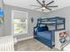 Cozy bedroom featuring a bunk bed, ceiling fan, and natural light at 6001- Q10 S Kings Hwy., Myrtle Beach, SC 29575