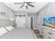 Relaxing bedroom featuring calming colors, ceiling fan, natural light, and wooden furnishings at 6001- Q10 S Kings Hwy., Myrtle Beach, SC 29575