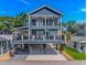 Beautiful, elevated beach house with double decks, outdoor entertainment space, and ample parking at 6001- Q10 S Kings Hwy., Myrtle Beach, SC 29575