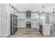 Modern kitchen featuring stainless steel appliances, white cabinets, and a marble backsplash at 6001- Q10 S Kings Hwy., Myrtle Beach, SC 29575