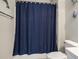 Bathroom with a toilet and navy blue shower curtain at 6015 Catalina Dr. # 634, North Myrtle Beach, SC 29582